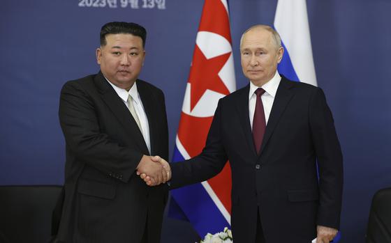 FILE - Russian President Vladimir Putin, right, and North Korean leader Kim Jong Un shake hands during their meeting at the Vostochny cosmodrome outside of Tsiolkovsky, in the far eastern Amur region, Russia on Sept. 13, 2023. (Vladimir Smirnov/Sputnik Kremlin Pool Photo via AP, File)