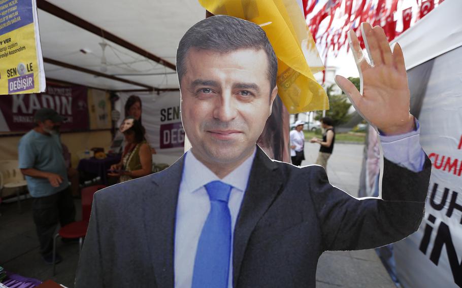 A cardboard cut-out of Selahattin Demirtas is pictured at an election kiosk in Istanbul, June 20, 2018.