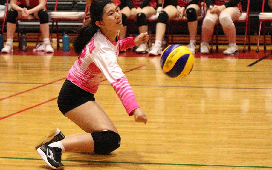 Nile C. Kinnick's Chizuru Nguyen digs the ball against American School In Japan during Tuesday's Kanto Plain volleyball match. The Mustangs won in two sets.