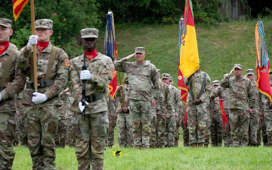 Commander of the 52nd Air Defense Artillery Brigade, Col. Bruce Bredlow, center, salutes during a change-of-command ceremony at Sembach Kaserne, Germany, on June 20, 2024, that saw Brig. Gen. Curtis King become leader of the 10th Army Air and Missile Defense Command.