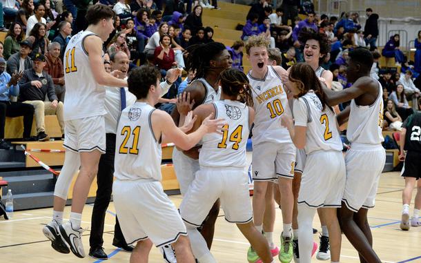 The Vicenza Cougars celebrate their Division II title after defeating Naples 76-37  in the boys Division II final at the DODEA-Europe basketball championships in Wiesbaden, Germany, Feb. 17, 2024. 