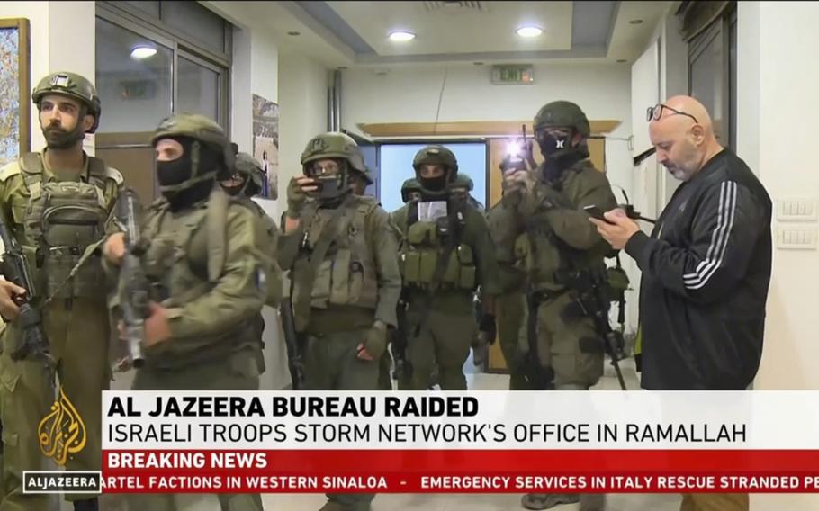 This image made from video provided by Al Jazeera English shows Israeli troops raiding their bureau in Ramallah, West Bank, Sunday, Sept. 22, 2024.