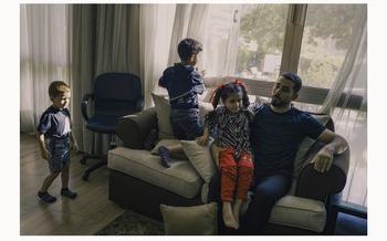 Abu Toha with, from left, Mostafa, 4. Yazzan, 8, and Yaffa, 7. With wife Maram, they live in an apartment provided by a university where Abu Toha had a writing residency. 