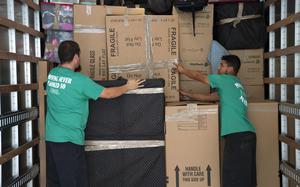 Movers at Scott Air Force Base, Ill., pack items belonging to a U.S. soldier moving to a another state, June 12, 2019. 