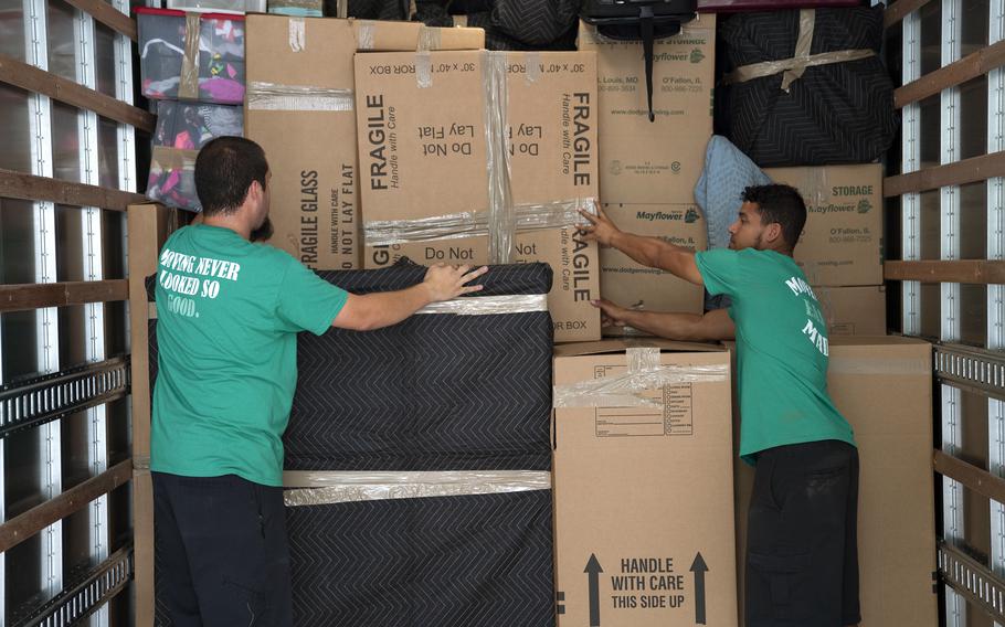 Movers pack items for military families in U.S.