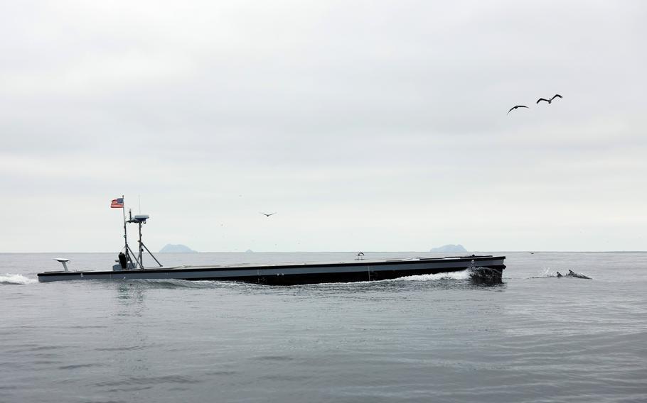 An unmanned, semisubmersible watercraft moves through the water off the coast of California. 