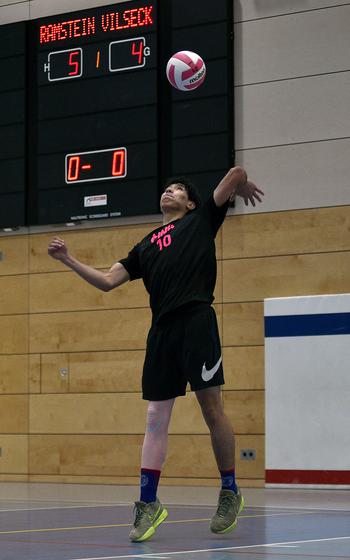 Nicholas Tunjano serves.