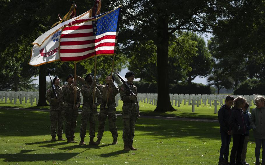 Flag bearers of the the 101st Airborne Division, known as Screaming Eagles, out of Fort Campbell, Ky., rehearse for a commemoration eighty years after the liberation of the south of the Netherlands at the Netherlands American Cemetery in Margraten, southern Netherlands, on Wednesday, Sept. 11, 2024.