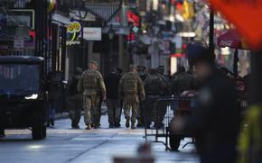 Military personnel walk down Bourbon street, Thursday, Jan. 2, 2025 in New Orleans. (AP Photo/George Walker IV)