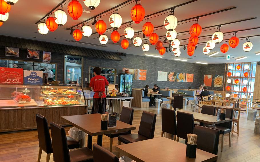 Kanimatsuri restaurant in Tokyo is decorated with red and white lanterns, giving the space a festive feel.