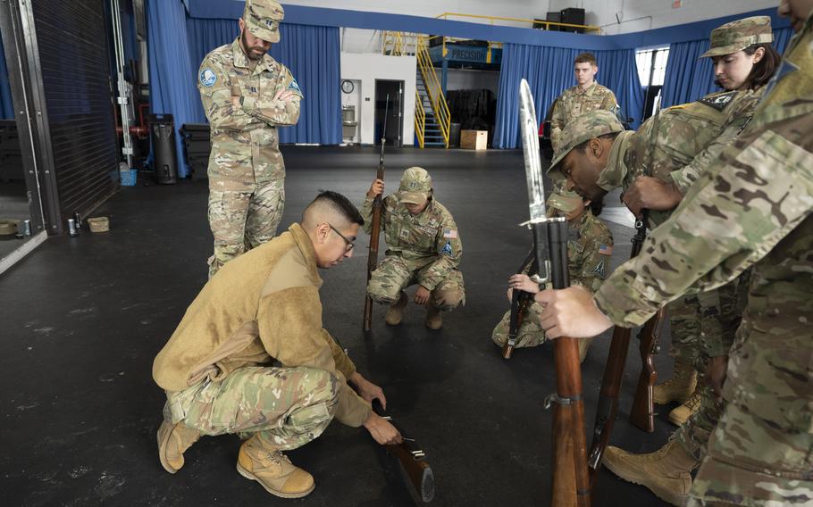 U.S. Air Force Tech. Sgt. Wayne Lufkins trains weapon fundamentals to Space Force Honor Guard augmentees