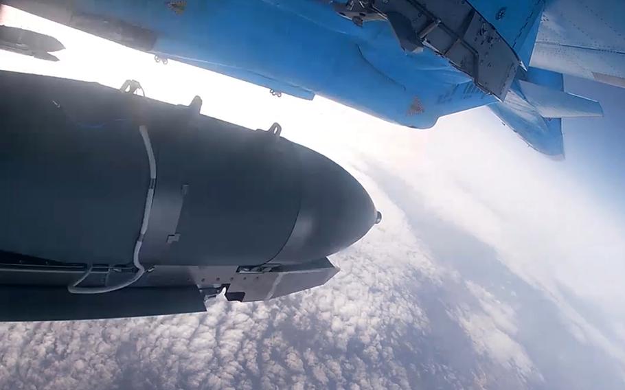 In this photo taken from video released by the Russian Defense Ministry on Thursday, Nov. 28, 2024, an Su-34 bomber of the Russian air force drops bombs on Ukrainian positions at an undisclosed location.