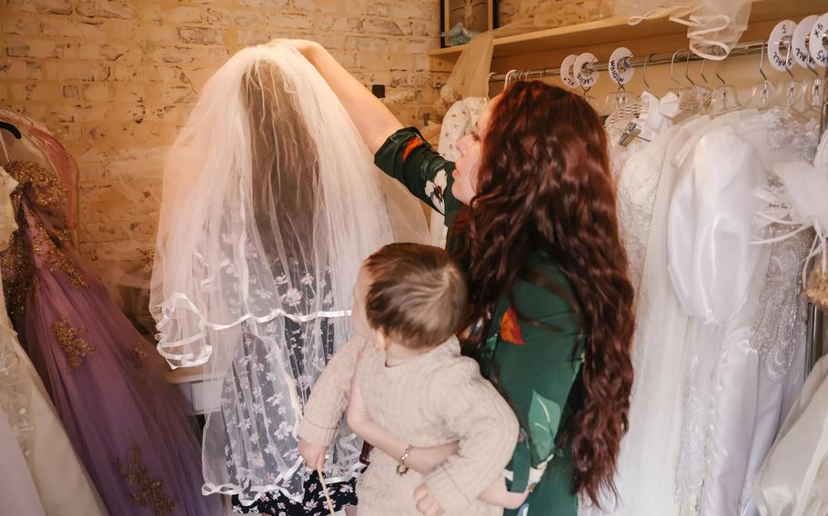 Ana Soriano tries on veils with future sister-in-law Priscilla Mendoza at the Old Brown House. 