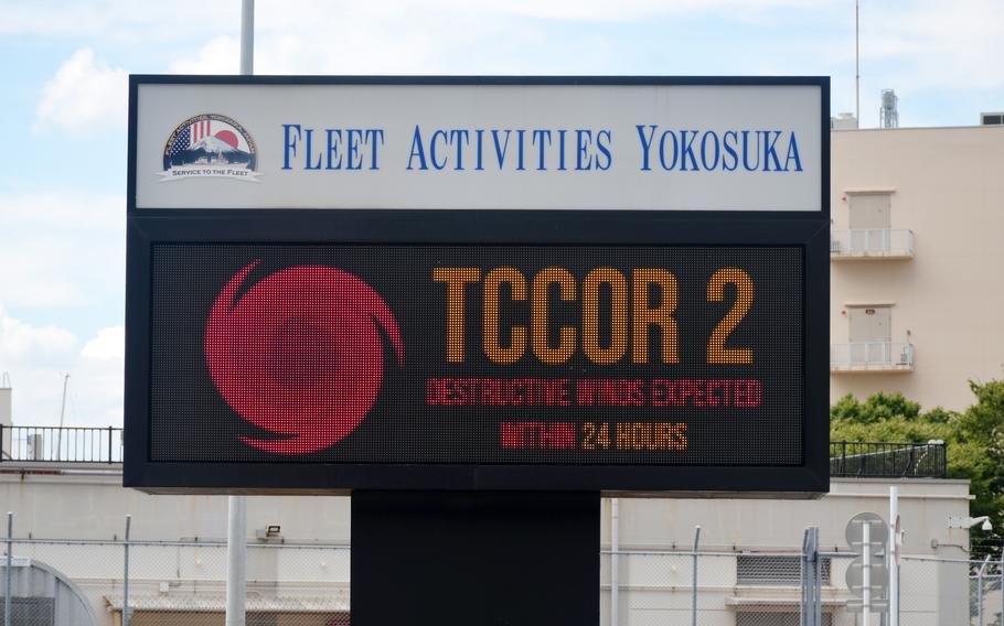 A sign at Yokosuka Naval Base, Japan, warns people about Typhoon Ampil, Thursday, Aug. 15, 2024. The storm is forecast to pass just south of Tokyo on Friday evening. 