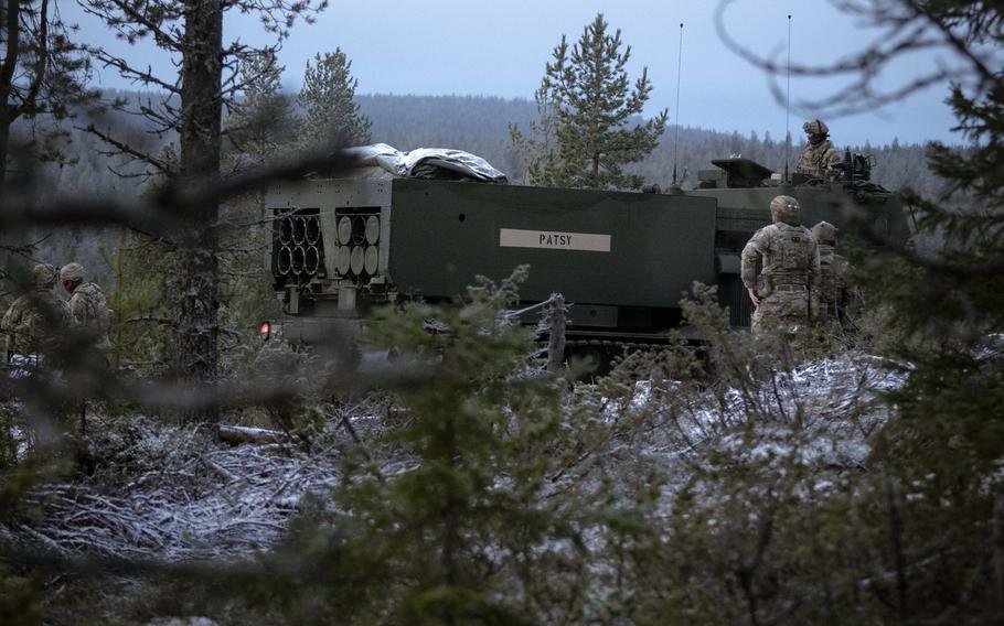 A U.S. Army MRLS is surrounded by trees during field training in Finland.