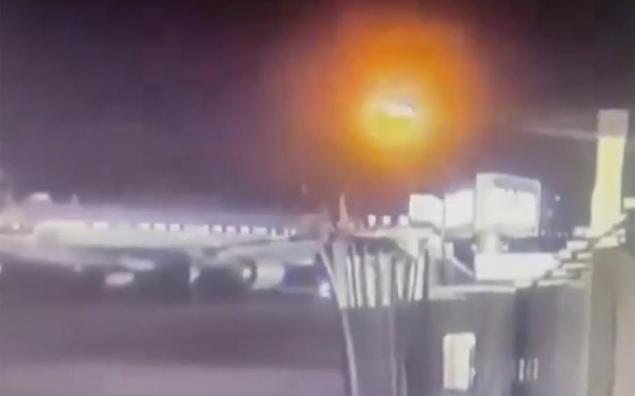 Grainy footage shows the explosion as a plane and a helicopter collide.