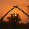 Sunrise over the Hands of Victory, 2004

Baghdad, Iraq, Jan. 17, 2004: Gigantic crossed sabers, held by giant hands representing the hands of former Iraqi leader Saddam Hussein, split the sky at sunset Saturday in Baghdad. The sabers form what is called the Victory Arch, which leads into parade grounds built by Saddam. The parade grounds honor the deaths of Iraqi soldiers during the Iran-Iraq war in the 1980s.

META TAGS: Operation Iraqi Freedom; Wars on Terror; 