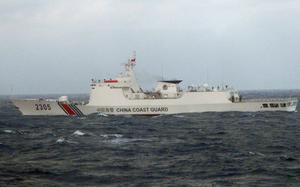 A ship with “China Coast Guard” written on the hull sails in open ocean waters.