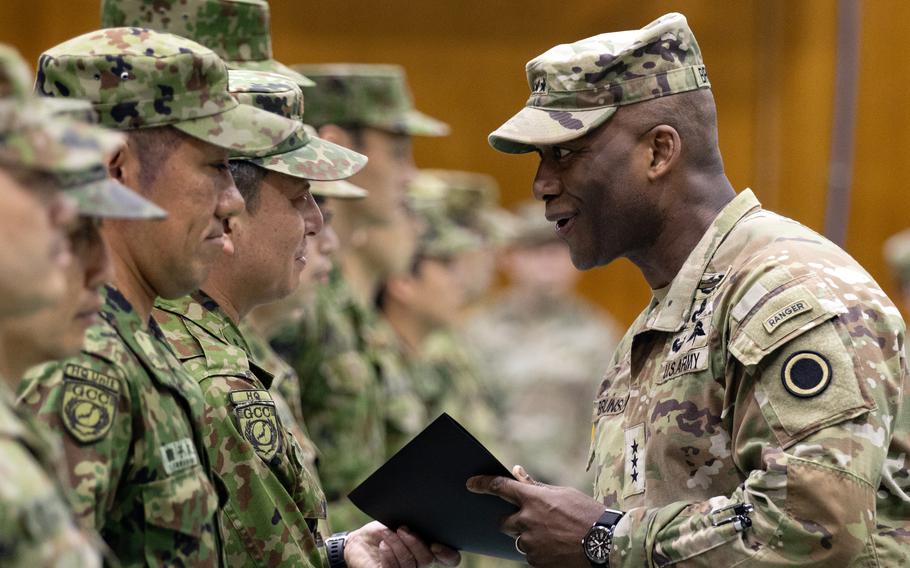 Lt. Gen. Xavier Brunson recognizes Japanese soldiers at the closing ceremony for the annual Yama Sakura exercise at Camp Asaka, Japan, in December 2023.