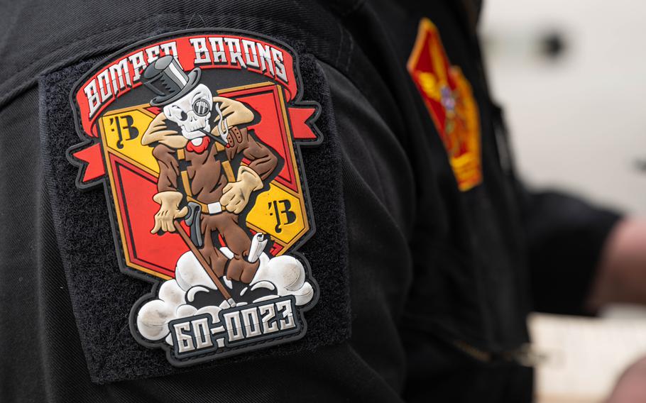 A red patch that says “Bomber Barons”