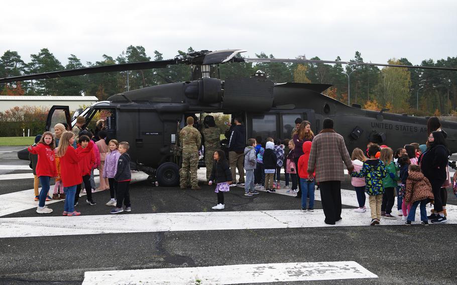 Grafenwoehr Elementary School students get a close look at a Black Hawk helicopter.