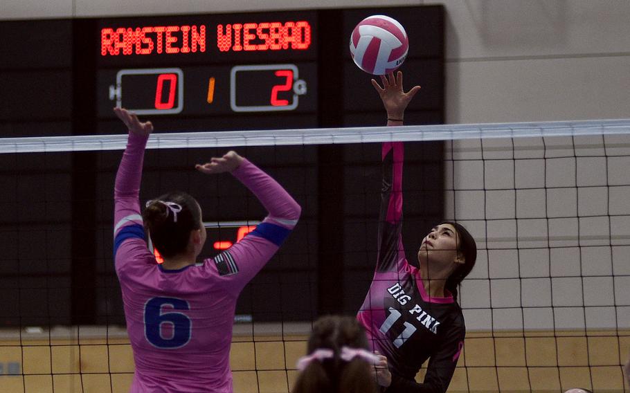 Nicole Suh hits the ball over the net.