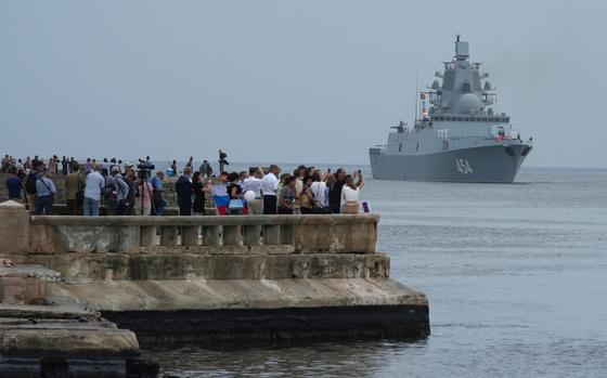 People watch Russian frigate Admiral Gorshkov as it enters Havana’s bay, Cuba, June 12, 2024. REUTERS/Alexandre Meneghini