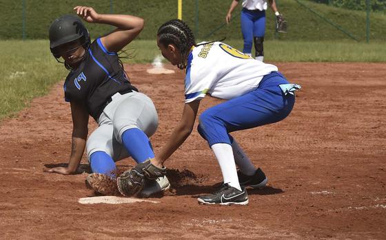 Hohenfels senior Jazlyn Campbell slides into home against Sigonella pitcher Alex Quintanilla during day one of the European champions on May 22, 2024, at Ramstein Air Base, Germany.  Hohenfels won the game 20-6.