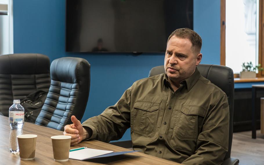 Andriy Yermak, in one of his signature army-green outfits, speaks with Washington Post journalists in April at the presidential office. 