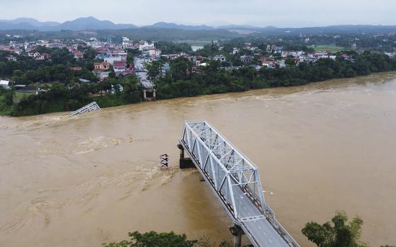 A bridge collapse due to floods triggered by typhoon Yagi in Phu Tho province, Vietnam on Monday, Sept. 9, 2024 (Bui Van Lanh/ VNA via AP)