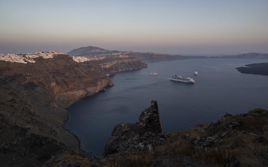 Ruins of a settlement, including a former Catholic monastery, lie on the rocky promontory of Skaros on the Greek island of Santorini