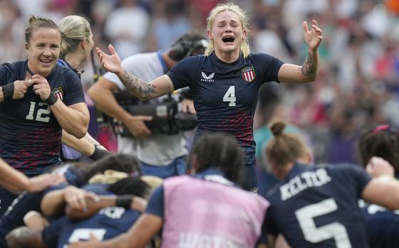 United States' Sammy Sullivan reacts as she joins her teammates after they won the women's bronze medal Rugby Sevens match between the United States and Australia at the 2024 Summer Olympics, in the Stade de France, in Saint-Denis, France, Tuesday, July 30, 2024. The US won the game 14-12. (AP Photo/Vadim Ghirda)