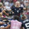 United States' Sammy Sullivan reacts as she joins her teammates after they won the women's bronze medal Rugby Sevens match between the United States and Australia at the 2024 Summer Olympics, in the Stade de France, in Saint-Denis, France, Tuesday, July 30, 2024. The US won the game 14-12. (AP Photo/Vadim Ghirda)