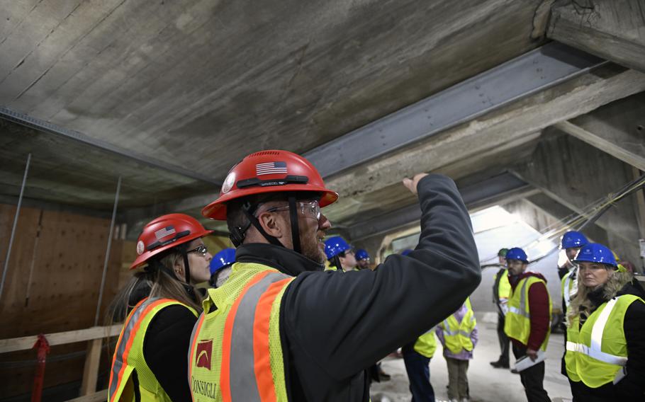 Construction workers show off the space underneath the Lincoln Memorial.