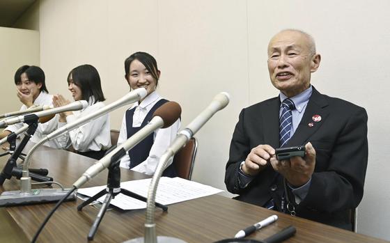 Toshiyuki Mimaki, right, president of Nihon Hidankyo, or the Japan Confederation of A- and H-Bomb Sufferers Organizations, speaks to media members in Hiroshima, Japan, Friday, Oct. 11, 2024, as he reacts to Ninon Hidankyo's winning the Nobel Peace Prize. 