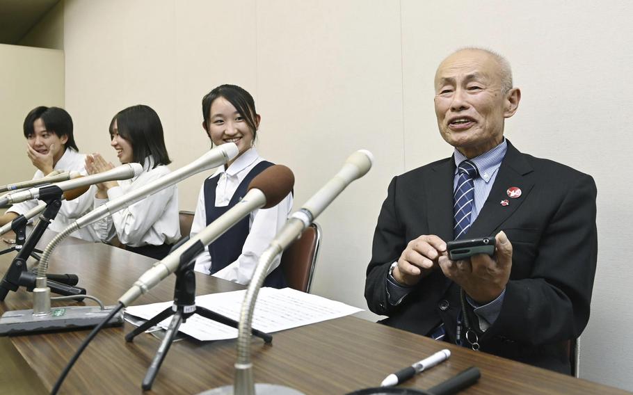 Toshiyuki Mimaki, right, president of Nihon Hidankyo, or the Japan Confederation of A- and H-Bomb Sufferers Organizations, speaks to media members in Hiroshima, Japan, Friday, Oct. 11, 2024, as he reacts to Ninon Hidankyo’s winning the Nobel Peace Prize. 