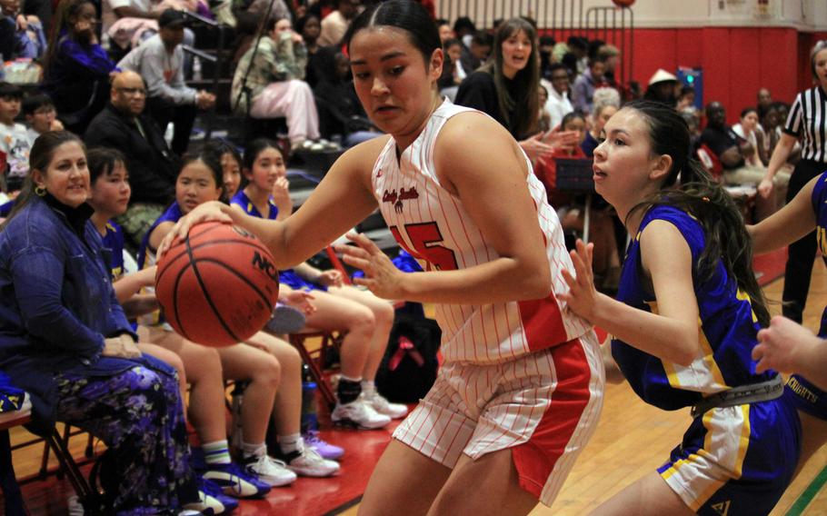 Leona Turner dribbles.