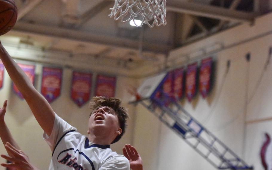 Nash Stoner tries to score after a rebound.