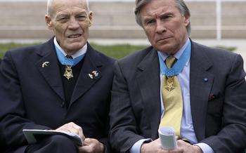 Medal of Honor recipients Robert L. Howard, left, and Paul Bucha at a National Medal of Honor Day wreath-laying at Arlington National Cemetery in March, 2009. Bucha died July 31, 2024 at age 80. 