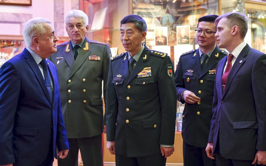 China’s Defense Minister Gen. Li Shangfu speaks to academy teachers as Chief of the Military Academy of the General Staff of the Armed Forces of the Russian Federation Col. Gen. Vladimir Zarudnitsky stands to the left of him during a visit to Military Academy of the General Staff of the Armed Forces of the Russian Federation in Moscow, April 17, 2023. China has removed Li, who vanished from public view nearly two months ago, in the latest in a string of high-level purges of the Chinese military apparently related to an investigation into weapons procurement.