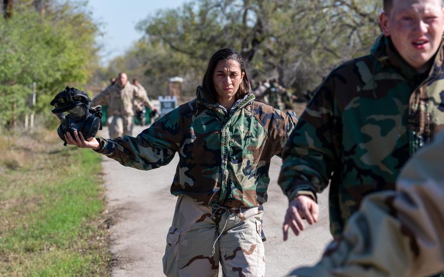 Trainee Anita Alvarez, 331st Training Squadron, walks along the road after going through the gas chamber