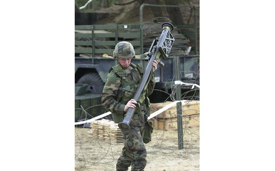 Chulmae Range, South Korea, Nov. 27, 2001: Army Pfc. Joshua Turknett, Alfa Battery 5 Battalion 5th Air Defense Artillery, stationed at Camp Casey, looks over his live stinger missile prior to going to the Chulmae Range, Korea, during Operation Sea Strike. Soldiers from 5th Battalion, 5th Air Defense Artillery, fired Stingers on at the beachside training range on the West Sea. The exercise was aimed to give the unit more confidence to fire the missiles. The Stinger, which debuted in 1982, remains a core of the Army’s low-altitude air defense.

Read the 2001 article and find additional photos here. 

META TAGS: U.S. Army; 5th Battalion, 5th Air Defense Artillery; Stinger Avenger unit; Soviet Afghan War; training; Operation Enduring Freedom; Chulmae Range; South Korea