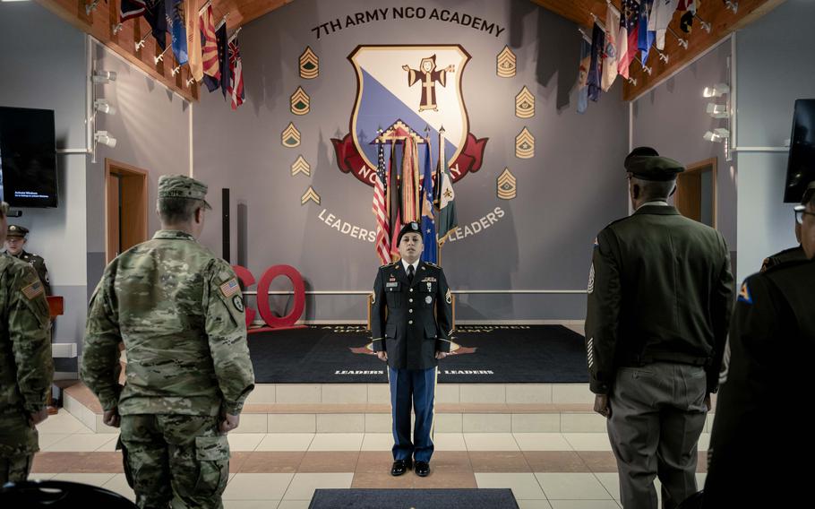 Officers and soldiers stand for a ceremony for the 75th anniversary of the 7th Army NCO Academy.