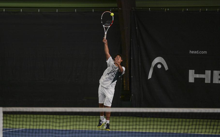 Naples' Tavi Shah launches into a powerful serve against Stuttgart's Zachary Call during the DODEA European tennis championships at T2 Sports Health Club in Wiesbaden, Germany, on Oct. 21, 2023.