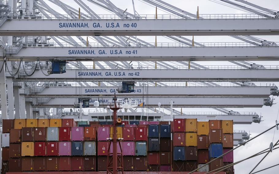 A vessel is loaded with containers by several ship to shore crane at the Georgia Ports Authority’s Port of Savannah Garden City Terminal, on Oct. 21, 2021, in Savannah, Ga. 