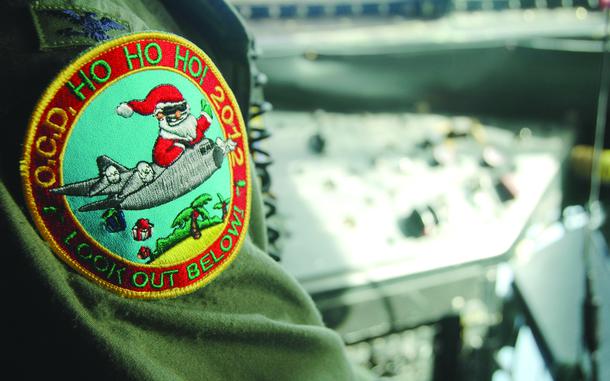 HED: Operation Christmas Drop, 2012

Yokota Air Base, Japan, Dec. 11, 2012: The Operation Christmas Drop 2012 patch worn by C-130 aircrew members from the 36th Airlift Squadron from Yokota Air Base, Japan. In its 61st year in 2012, the mission is the Defense Department’s longest-running humanitarian mission. 

Check out Stars and Stripes' coverage of Operation Christmas Drop over the years here:

https://www.stripes.com/migration/troops-in-pacific-play-santa-in-world-s-longest-running-humanitarian-mission-1.200951

https://www.stripes.com/migration/airmen-play-santa-in-annual-christmas-drop-for-pacific-islanders-1.42205

https://www.stripes.com/migration/airmen-prepare-for-annual-christmas-gift-drop-to-pacific-islanders-1.41574

https://www.stripes.com/migration/air-force-to-drop-tons-of-gifts-on-pacific-islands-1.86160

https://www.stripes.com/migration/santa-comes-by-plane-for-operation-christmas-drop-1.72459

https://www.stripes.com/theaters/asia_pacific/yokota-guam-airmen-play-santa-to-islanders-for-annual-christmas-drop-1.128806

https://www.stripes.com/history/2015-12-13/air-force-presents-an-early-christmas-to-pacific-island-villages-1817956.html1

https://www.stripes.com/theaters/asia_pacific/air-force-airdrops-bring-early-christmas-to-micronesia-1.383137

https://www.stripes.com/migration/air-force-gears-up-for-operation-christmas-drop-with-help-from-japan-australia-1.501475

https://www.stripes.com/migration/yokota-s-new-super-hercules-cargo-planes-take-over-christmas-drop-mission-1.503340

https://www.stripes.com/migration/airmen-santas-swap-sleighs-for-c-130s-to-deliver-gifts-to-some-of-the-world-s-most-remote-islands-1.560295

https://www.stripes.com/theaters/asia_pacific/2020-12-03/Palau-islanders-to-receive-extra-Christmas-Drop-aid-after-Micronesia-opts-out-over-pandemic-1515739.html

https://www.stripes.com/theaters/asia_pacific/2021-12-09/operation-christmas-drop-yokota-col-andrew-campbell-3917351.html

https://www.stripes.com/theaters/asia_pacifi