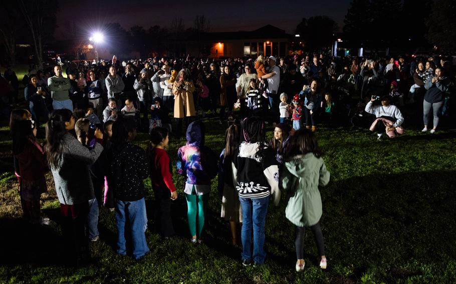 A crowd gathers to hear the youth choir/