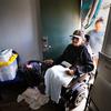 Delmar Dreaming Bear, 73, is helped into his motel room by his daughter, Dakotah Dreaming Bear.  (Nelvin C. Cepeda / The San Diego Union-Tribune)