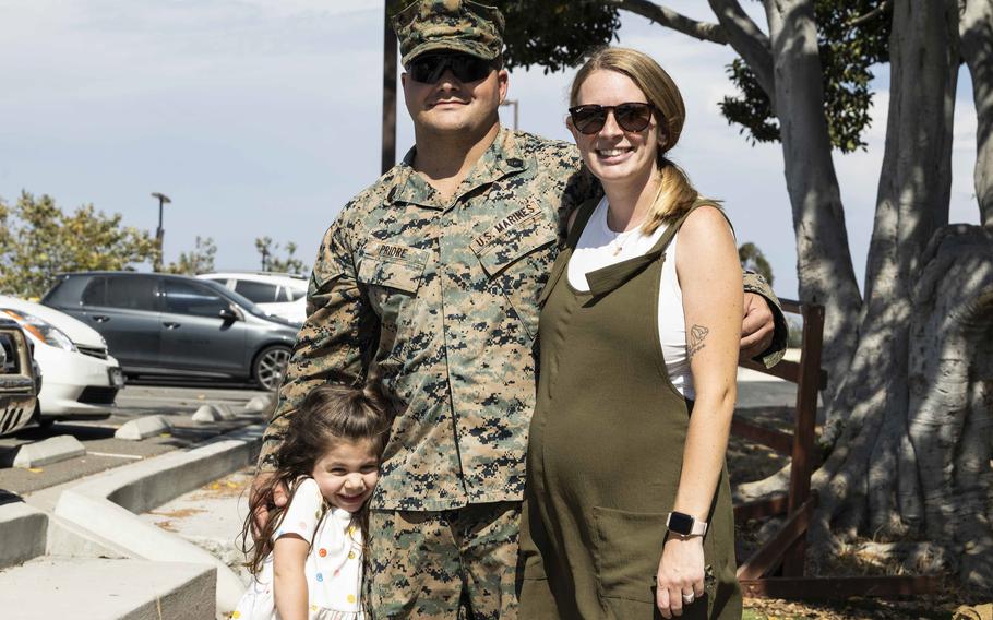 U.S. Marine Corps Gunnery Sgt. Joseph Priore, the company gunnery sergeant of Charlie Company, Battalion Landing Team 1/5, 15th Marine Expeditionary Unit, and a native of Charlotte, N.C., poses with his wife and daughter at Marine Corps Base Camp Pendleton, Calif., on Aug. 10, 2024, after returning from deployment.