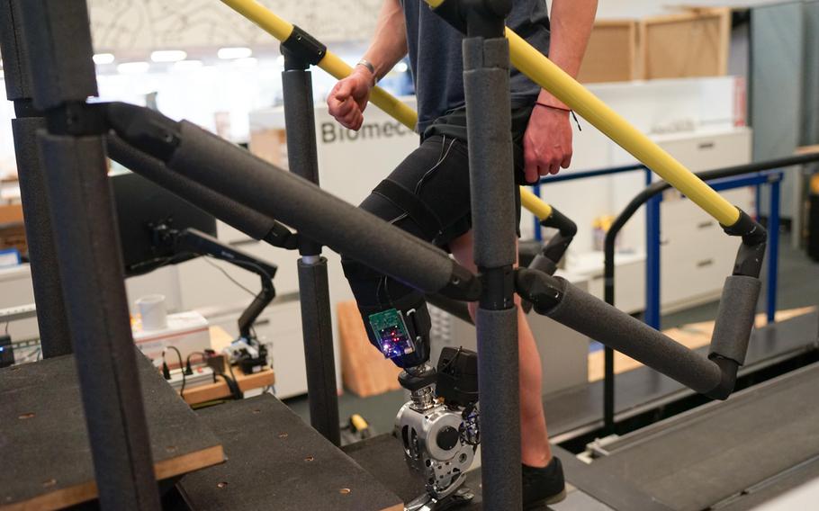 A study participant demonstrates a novel prosthetic limb that can be controlled by the brain. 